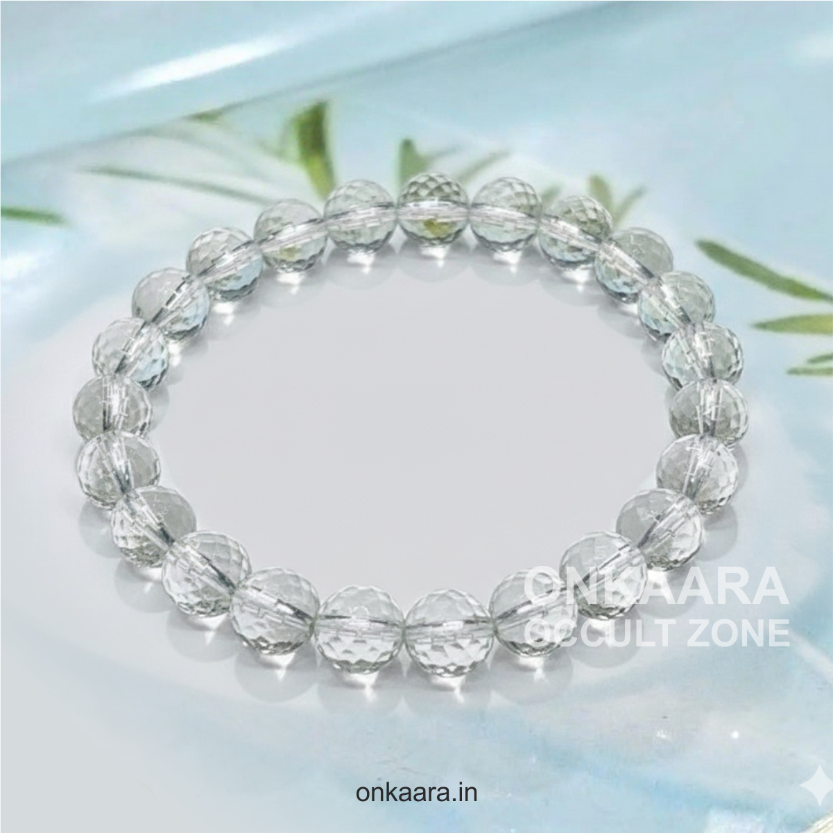 Clear quartz crystal bead bracelet held in hand – Onkaara Occult Zone bracelet for healing and positivity.